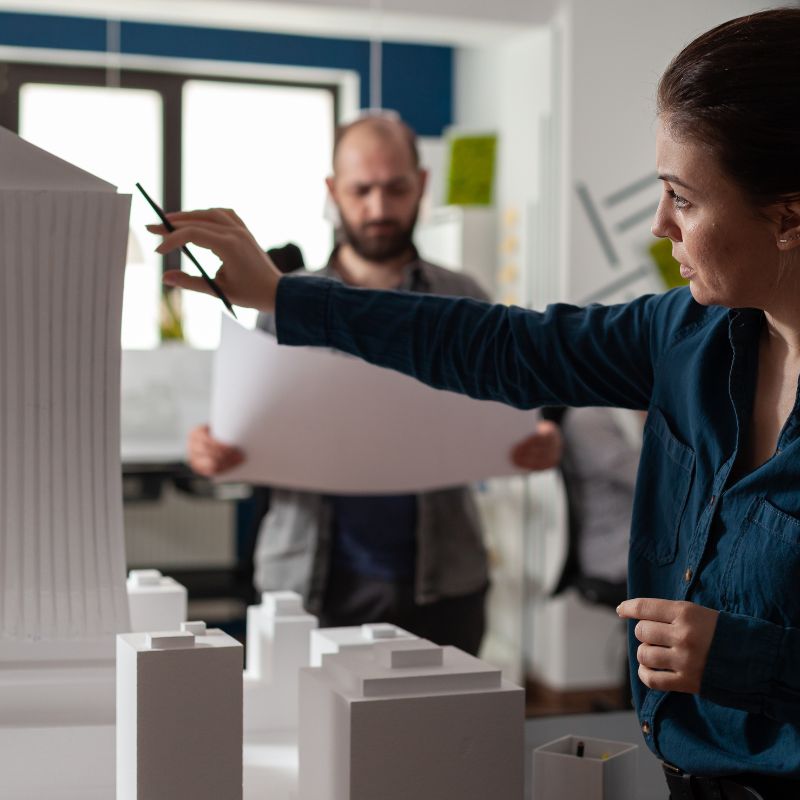 Architects looking at design blueprints