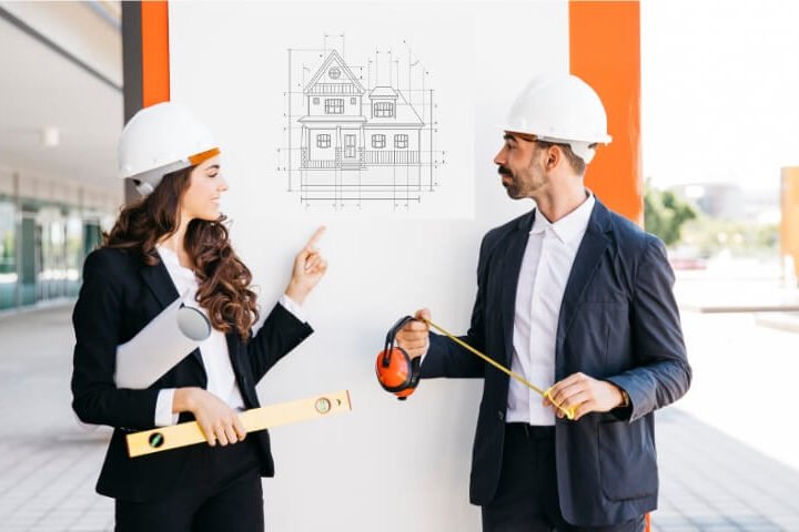 Architect engineers showing plan-building on construction whiteboard